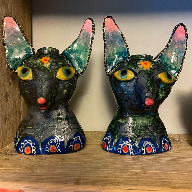 Small sculpture of the head of a fox, painted and decorated