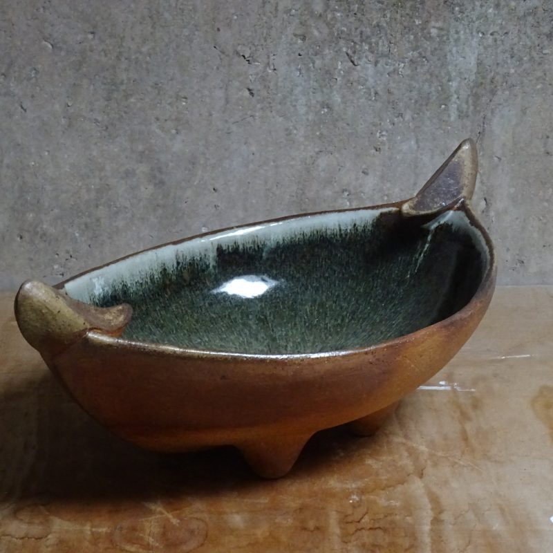 Oval bowl with green glaze