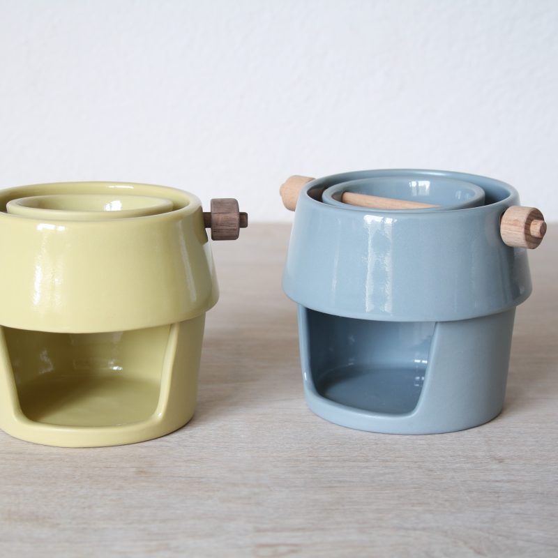 Ceramic oil burners with beech/ walnut components in blue-grey and citron yellow