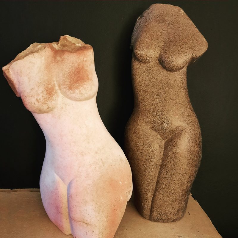 Stone carved female torsos 