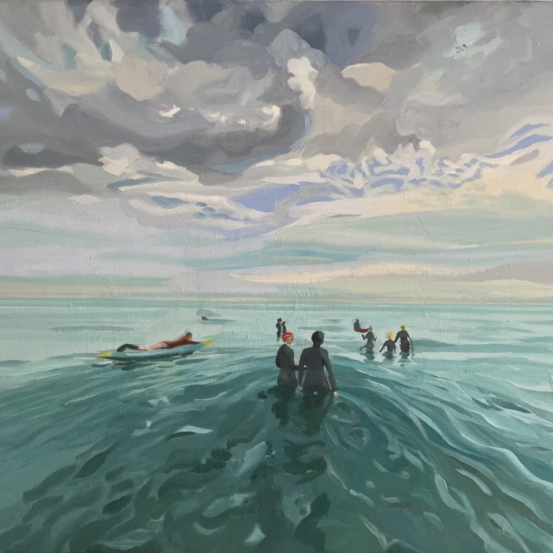 Viewer is drawn into this painting of swimmers in wetsuit making their way out to sea accompanied by lifeguards and kayakers in this training swim