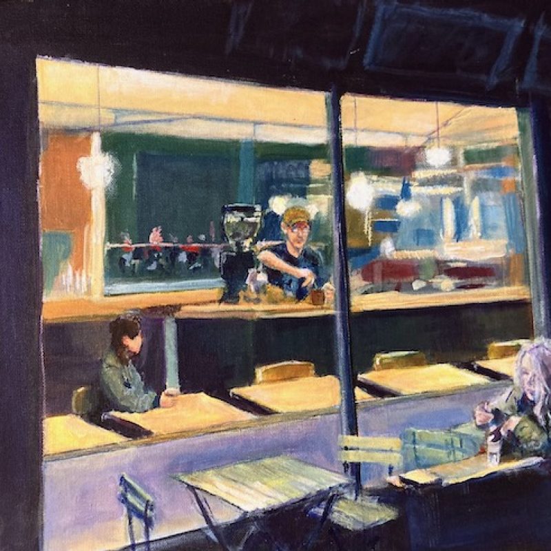 A cafe at night. A barista prepares a coffee whilst a seated customer looks on. Another customer is seated outside