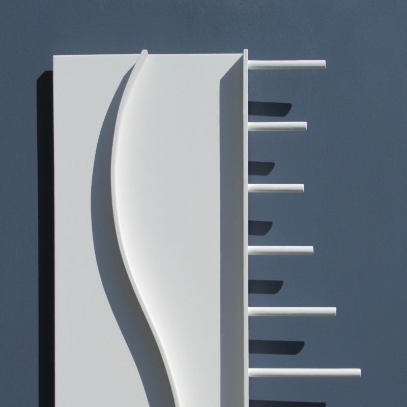 White relief with curved element