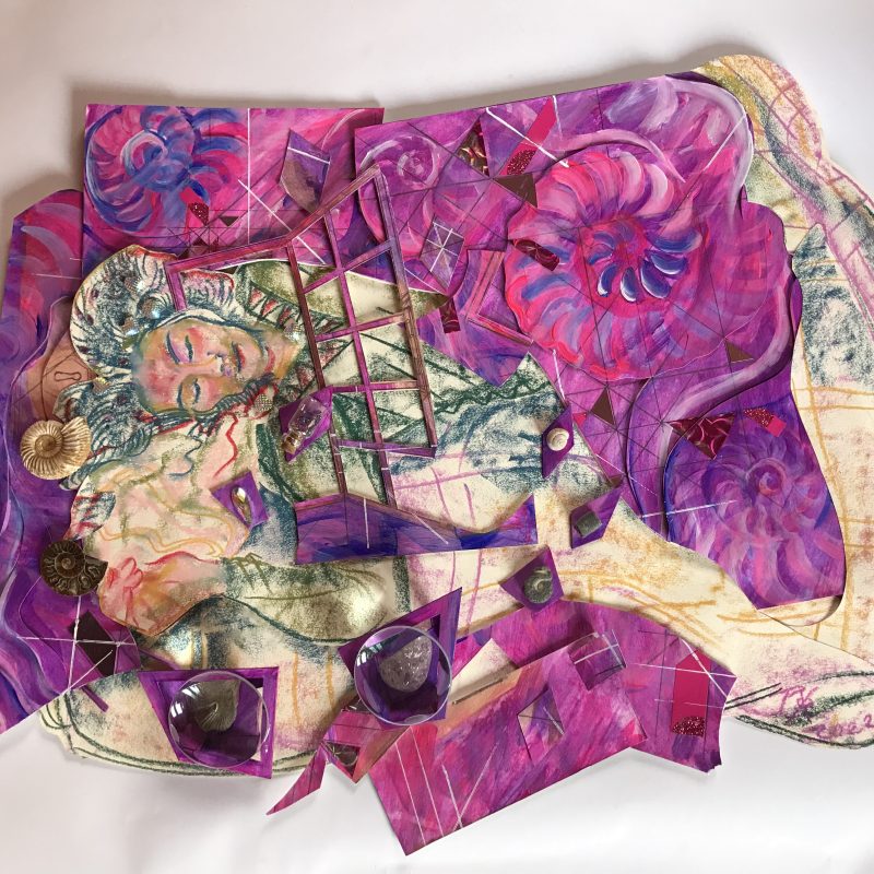 A woman in a purple bed with ammonites and a treasure chest from Lyme Regis Museum