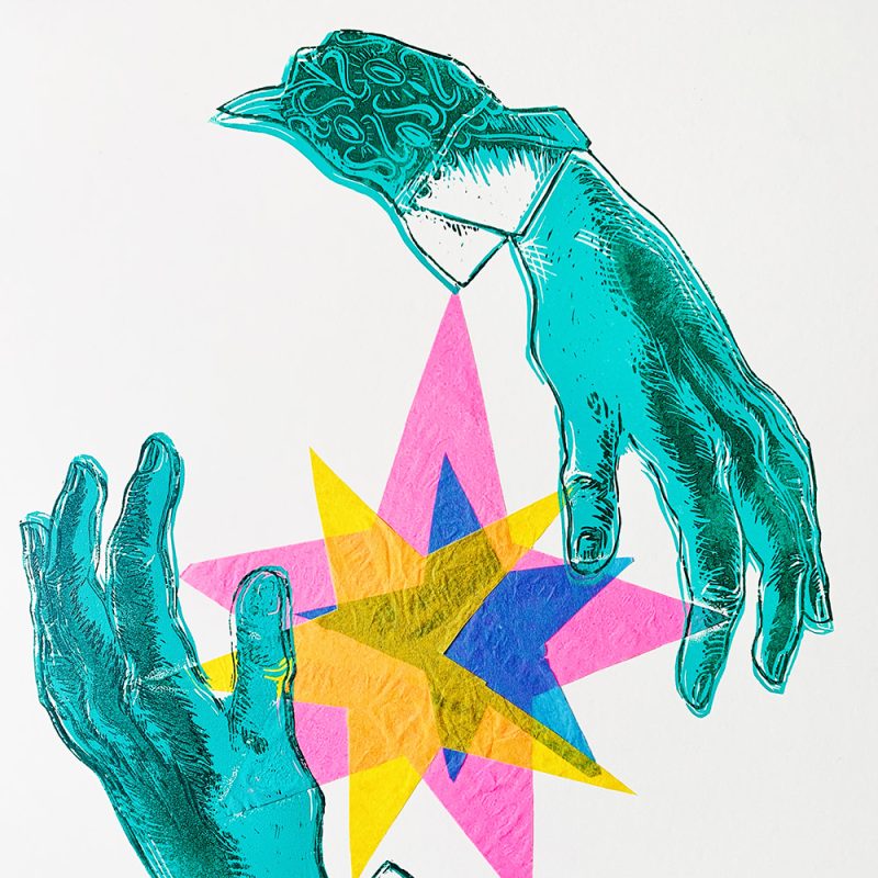 A reduction lino of two hands around a flash of light created by layers of bright coloured tissue.