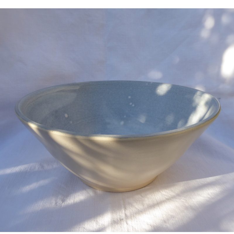 Hand thrown ceramic fruit bowl with foot ring; decorative grey and white slip to the inside and a bare stoneware clay to the outside. 