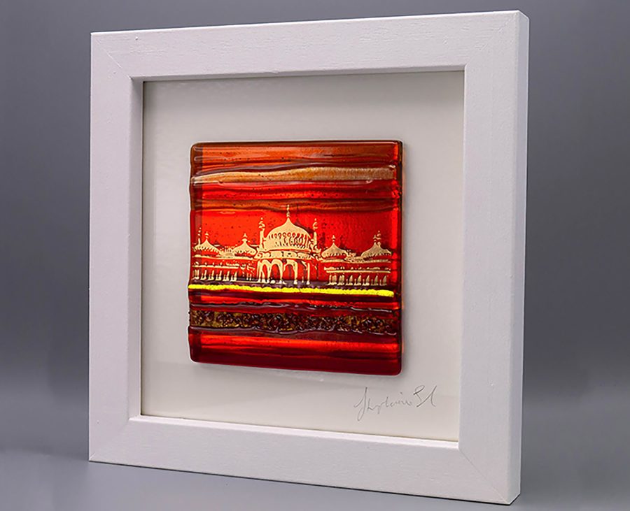 A textured Glass Tile in shades of orange glass with an abstract image of the Royal Pavilion in shiny 22ct gold