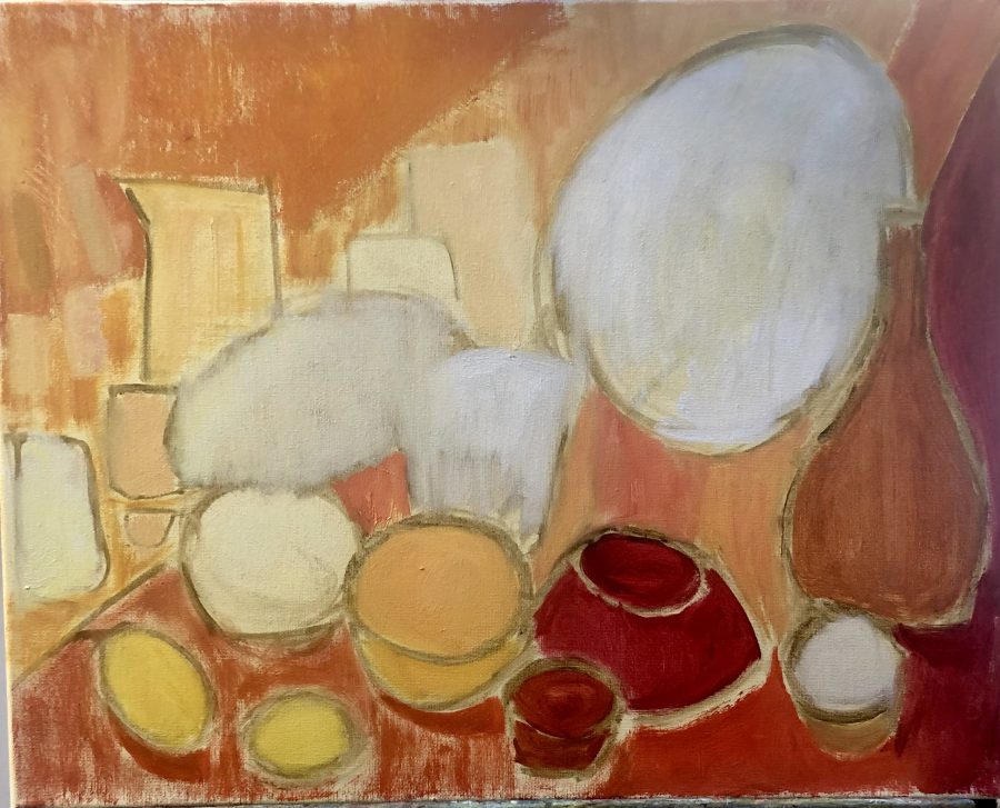 A still life of jugs, vases, bowls, plates and lemons in shades of reds,oranges and yellows.