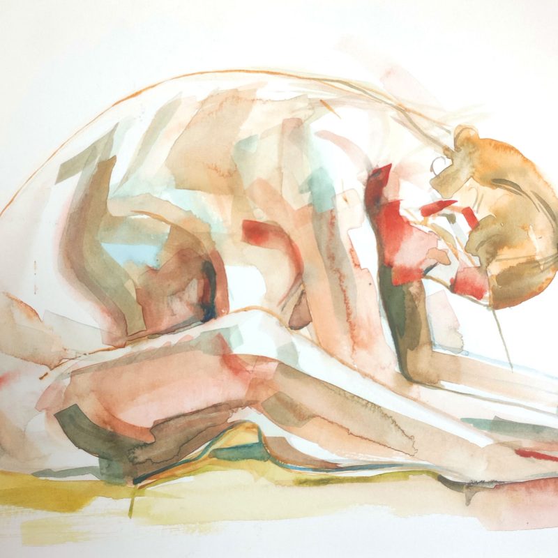 Figure sat on the floor, bent forward with hands clasping feet, head down, stretching back. 