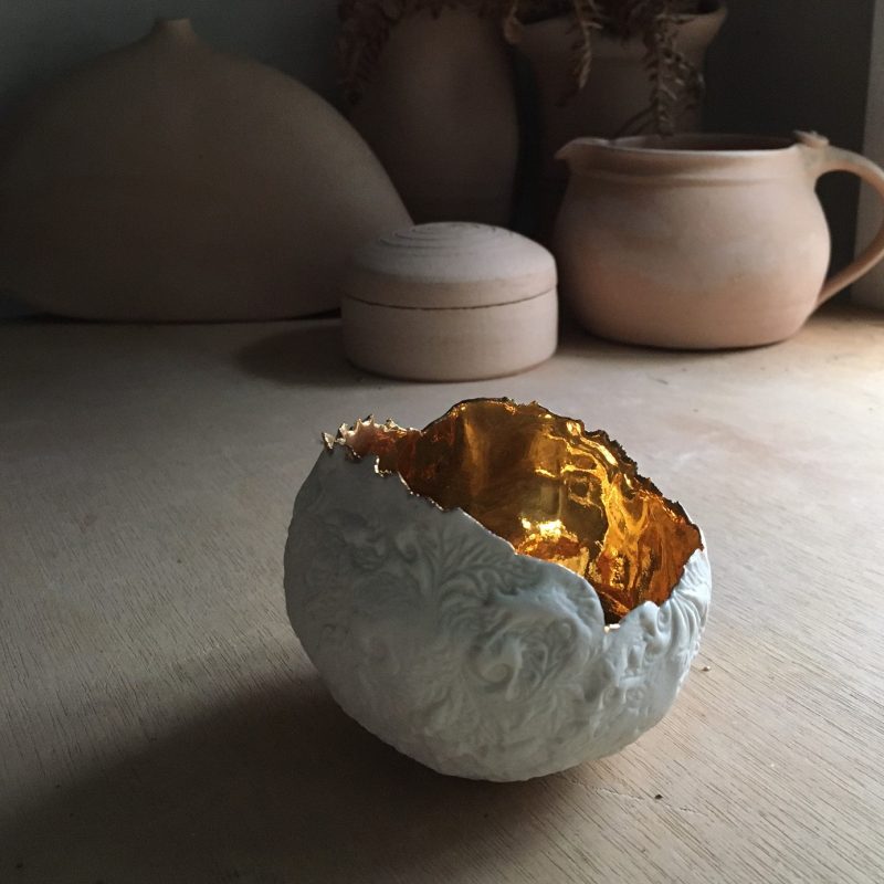 White textured bowl with gold interior