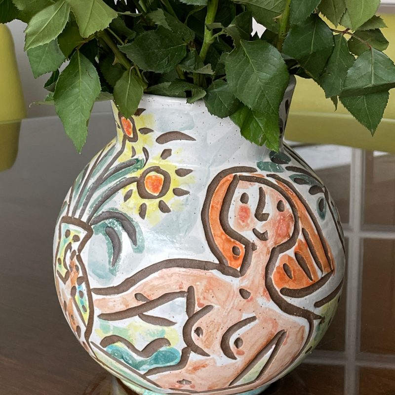 Large round vase with naked woman with flowers.
