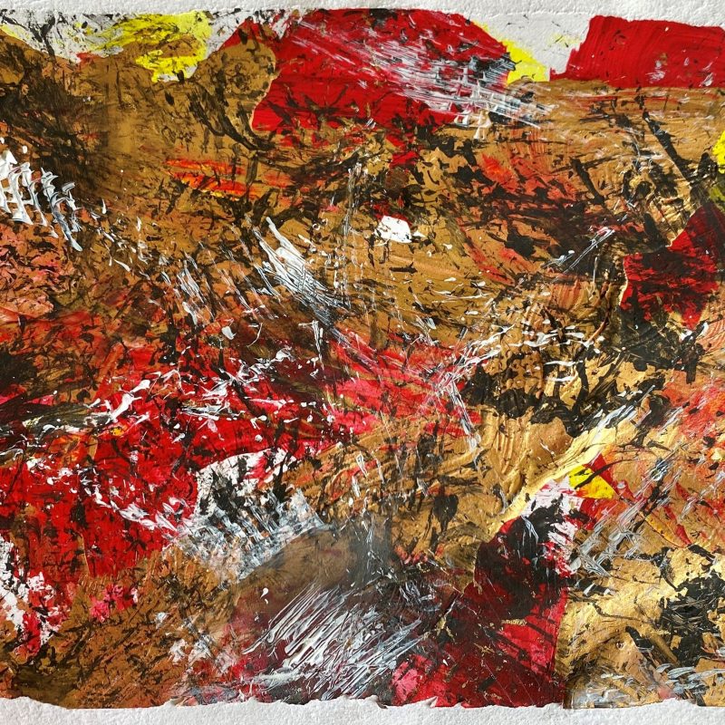 An abstract painting on watercolour paper. The colours are a mixture of gold, red, black, yellow and white. The paint is layered thickly, only small amounts of paper can still be seen at the edges. The red and gold have been applied first, then more delicate marks in black and white have been layered over the top.