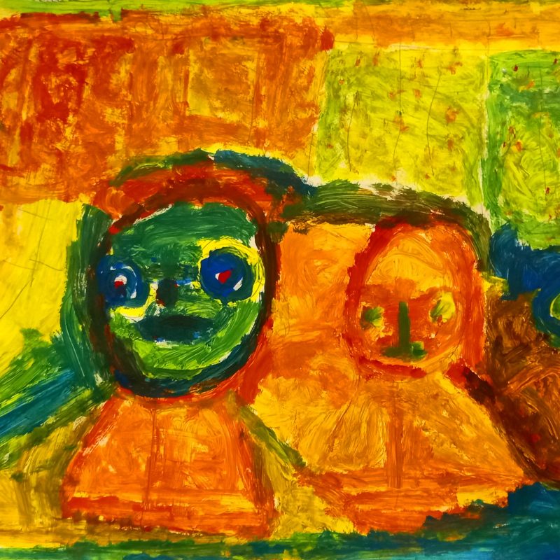 Three abstract faces on a background of yellow and orange