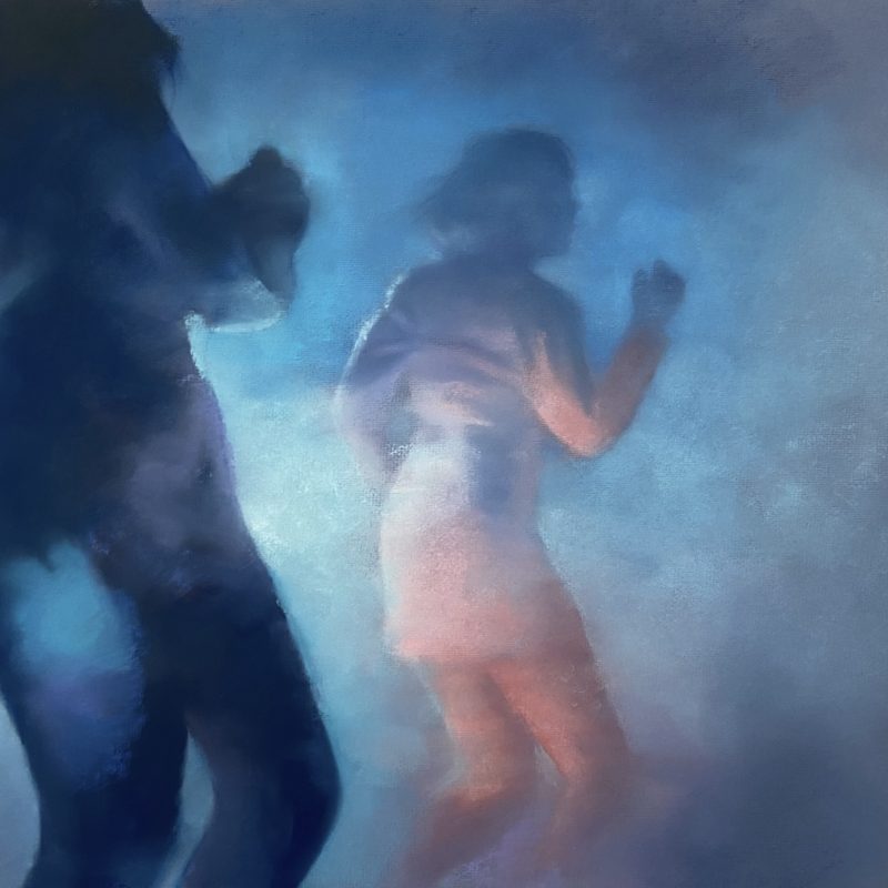 Two figures dancing in a club 