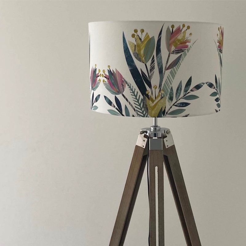 White lampshade decorated with a softly coloured tulip design
