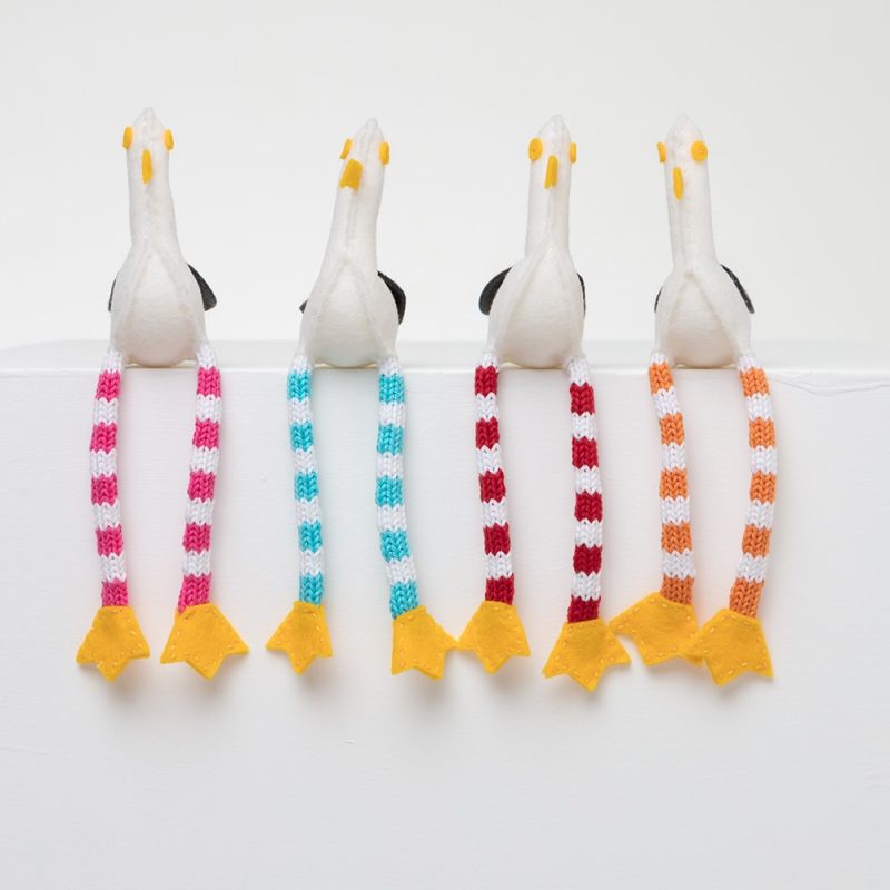 Fabric seagulls with long stripey legs