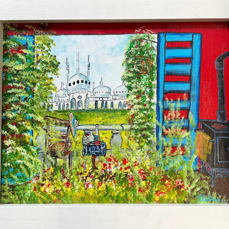 A window leading to a garden with the Royal Pavilion in the back ground