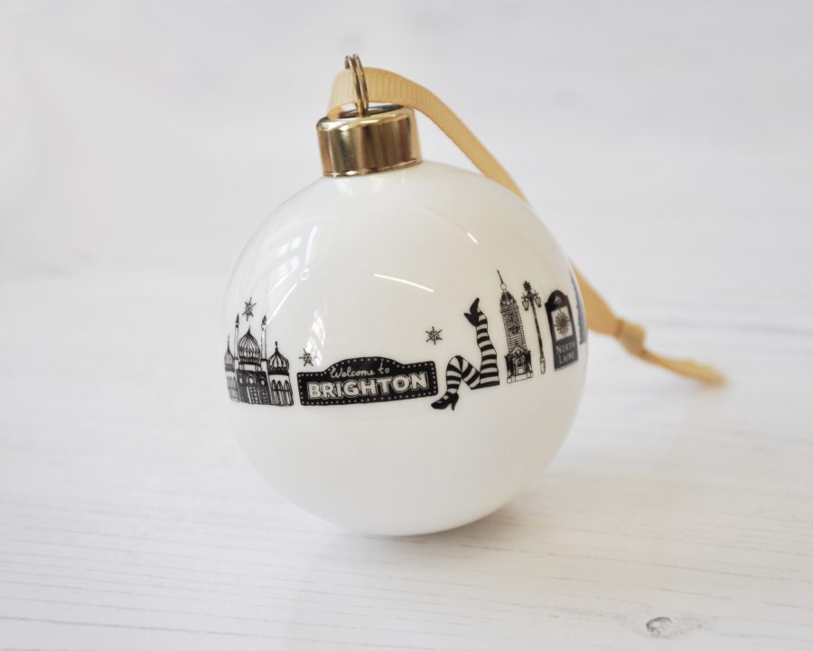Black & white Brighton illustrations on a white ceramic Christmas bauble