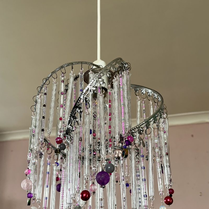 Lightshade made with glass pipettes beads and crystals evoking a fountain