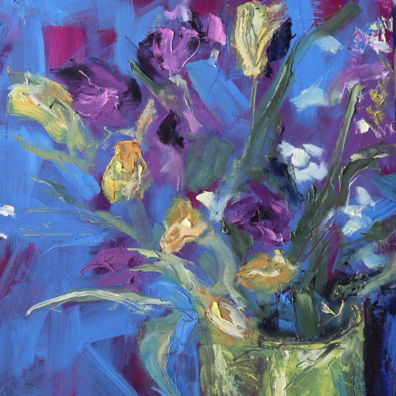 Flowers in a vase against a blue background
