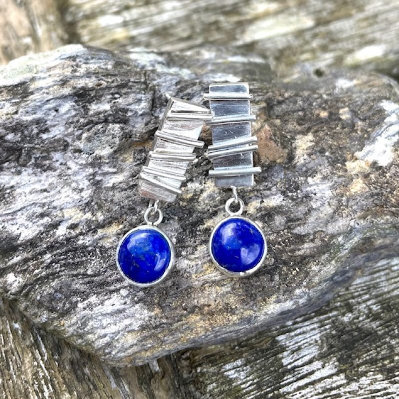 Rectangular earrings - post ear fitting - featuring 3D line pattern, with free-moving, linked round blue Lapis Lazuli cabochon gemstones.