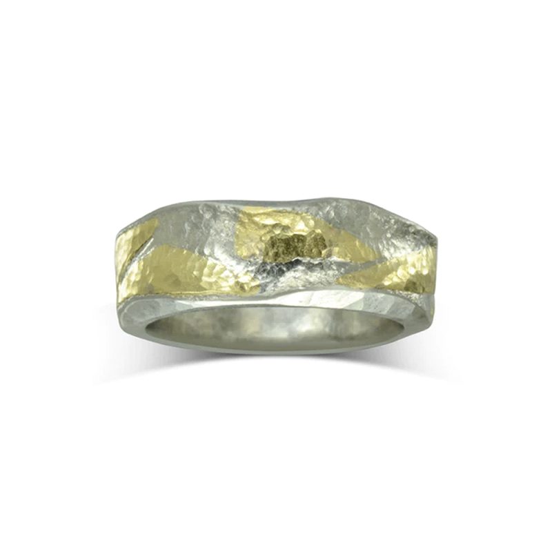 A Platinum Textured Side Hammered Wedding Ring with gold pieces hammered into the surface.