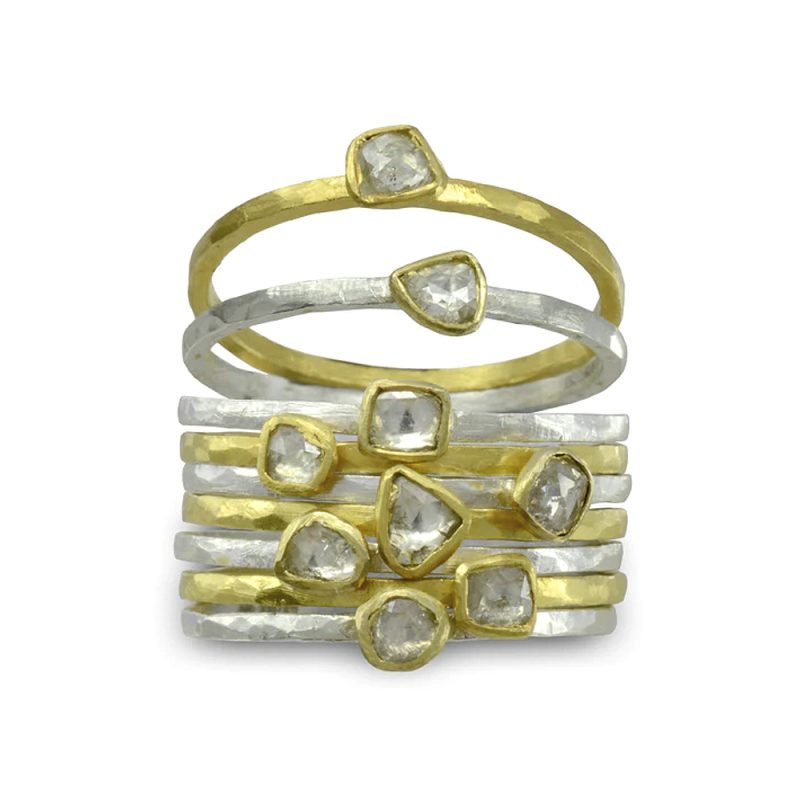 Rough hammered narrow bands made from fine square wire with rough diamonds in gold settings.