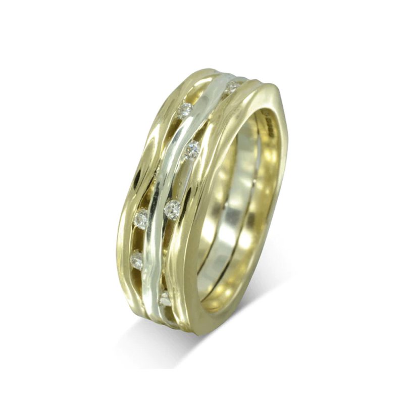 Three side-hammered bands with undulating edges. The bands (yellow gold on the outside and white in the middle) are joined together with diamonds set in the gaps between them.