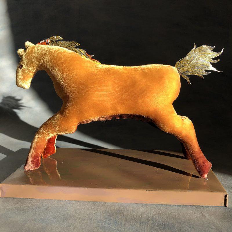 Golden coloured velvet horse with tin mane and tail