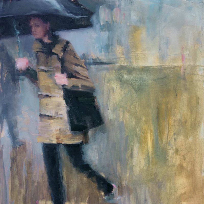 Woman walking with umbrella and bag