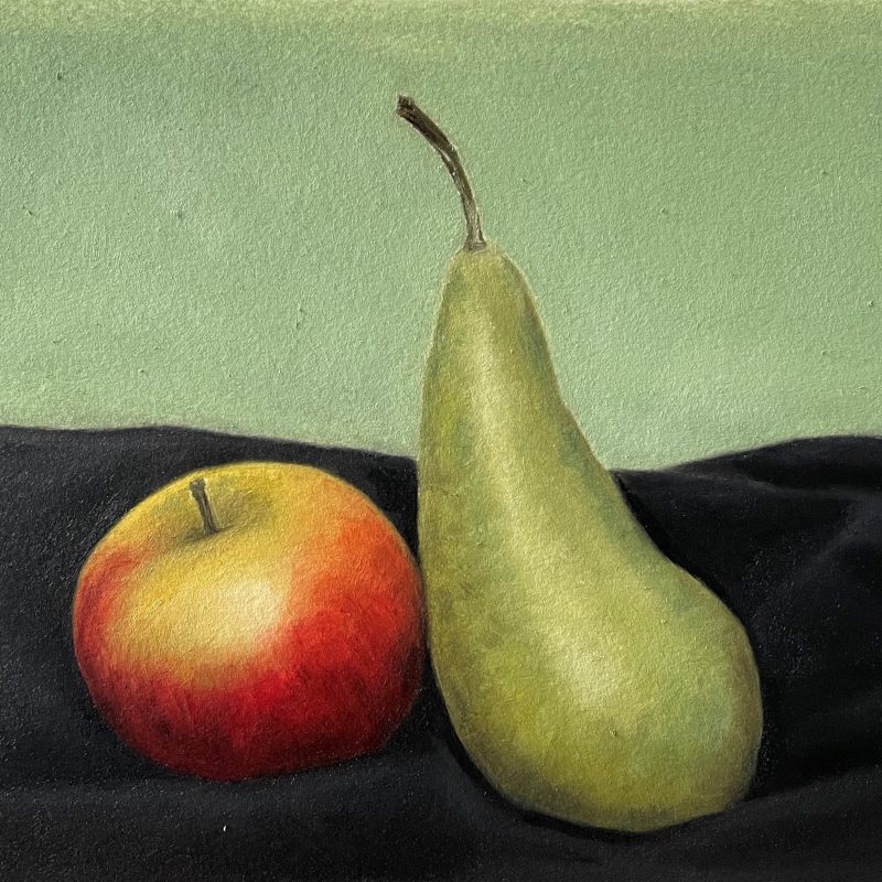 Rosy Apple and green pear on black cloth