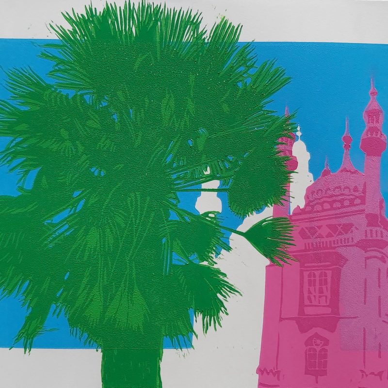 A Linocut print of a green palm in front of a bright pink Brighton Pavilion, on a sky blue background
