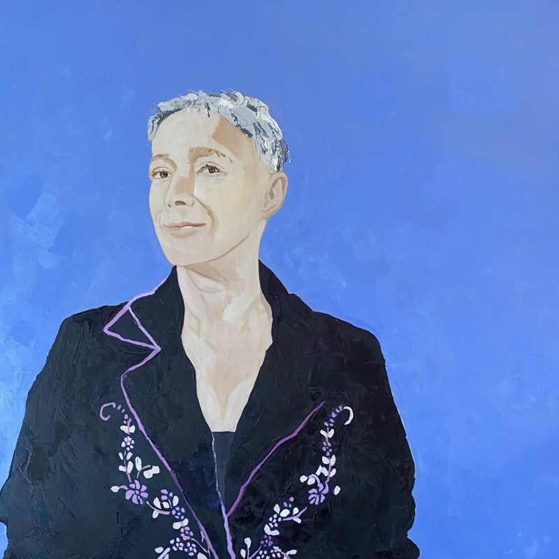 This is a portrait of Sasha Hails, painted with a blue background and a black coat with embroidery on it
