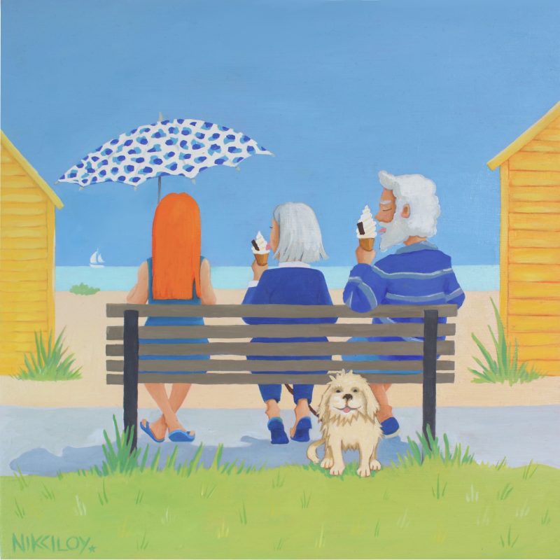 Brightly Coloured painting of three people all in blue, sitting on a bench in the sun looking out to sea eating ice-creams, between two bright yellow beach huts, only their little blonde dog looks at us. 