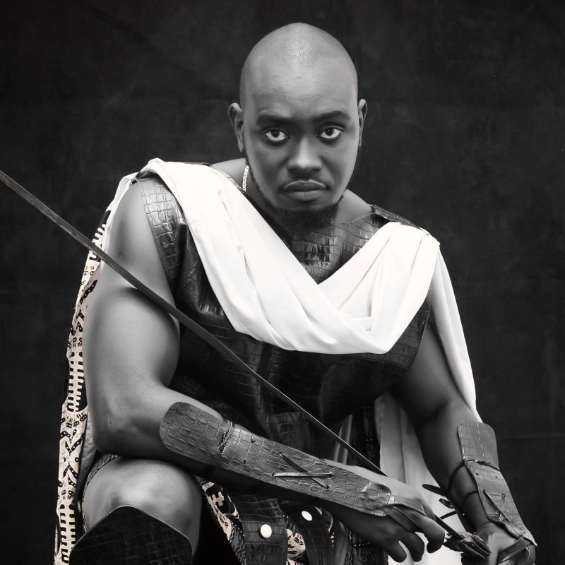 White and black artistic picture of a kneeling sub-Sahara look like Roman soldier 