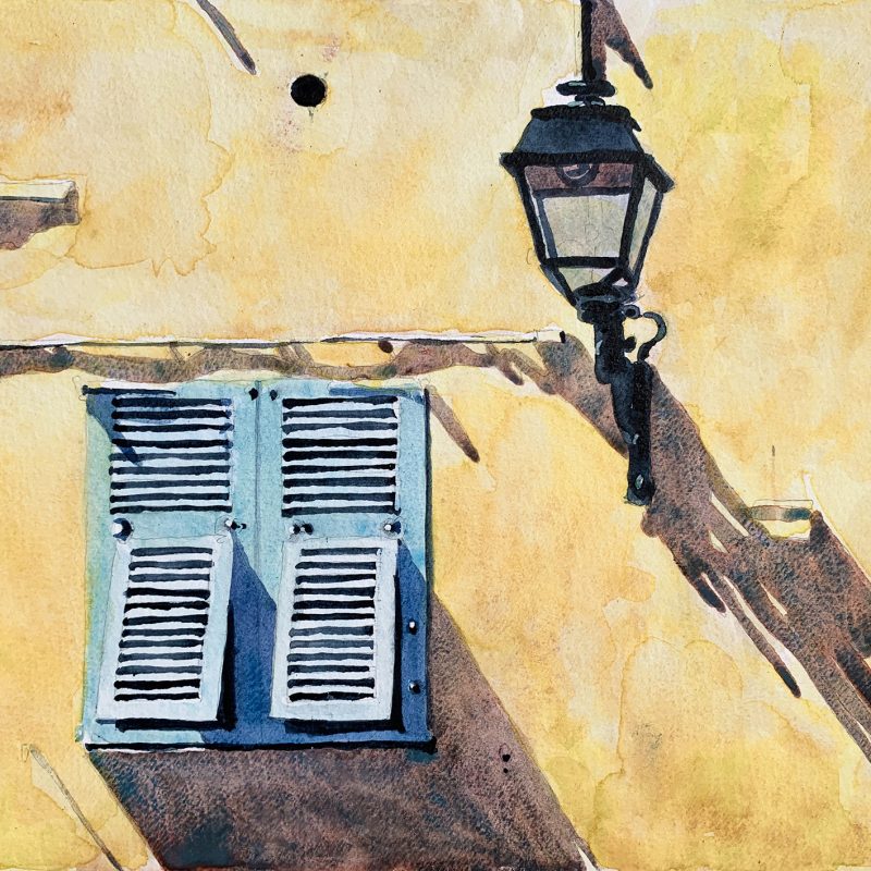 Blue Shutters on a yellow wall