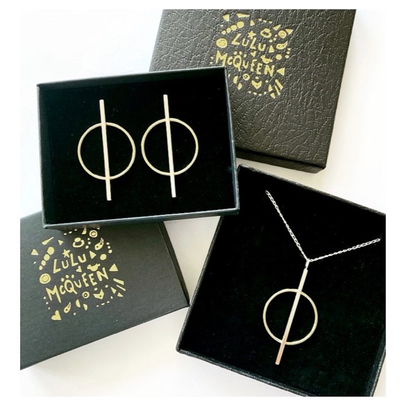 Modern sterling silver and brass geometric earrings and necklace.