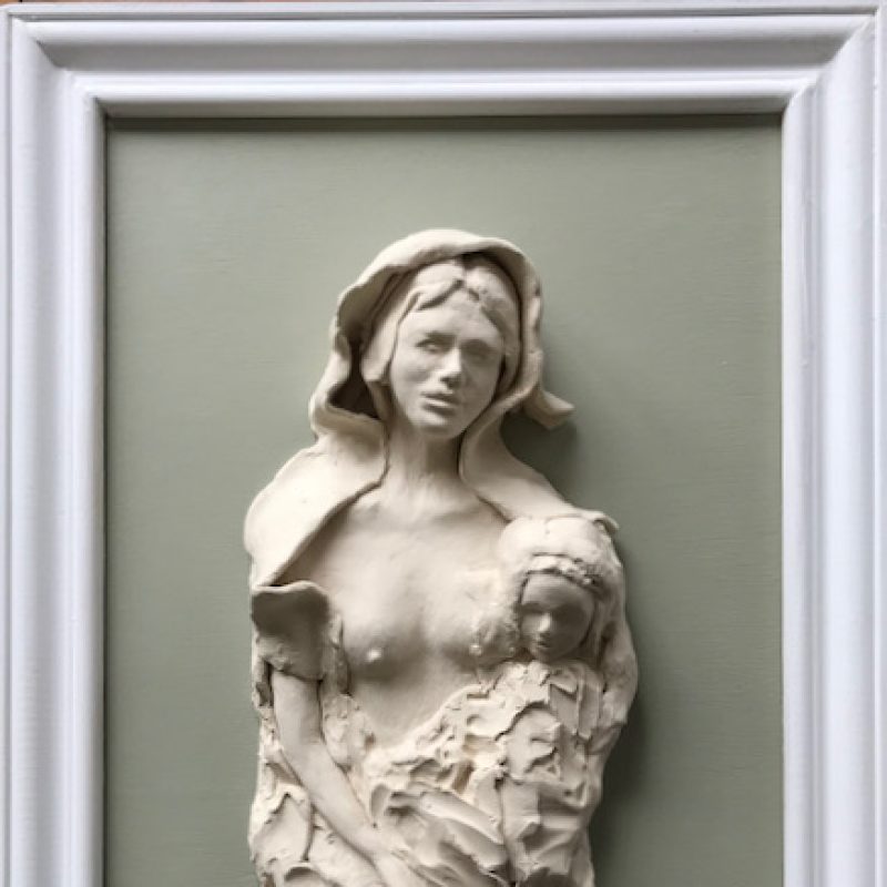 Mother and child in bas relief mounted on frame