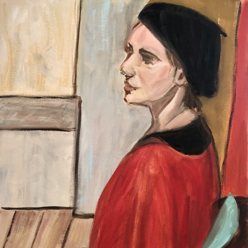 Woman in a red top woth a black beret