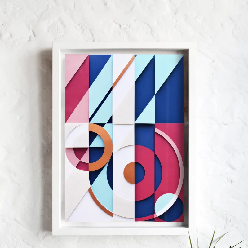 The artwork is one of a kind, hand-cut out of multiple layers of coloured paper and placed onto a stiff backing board. 
