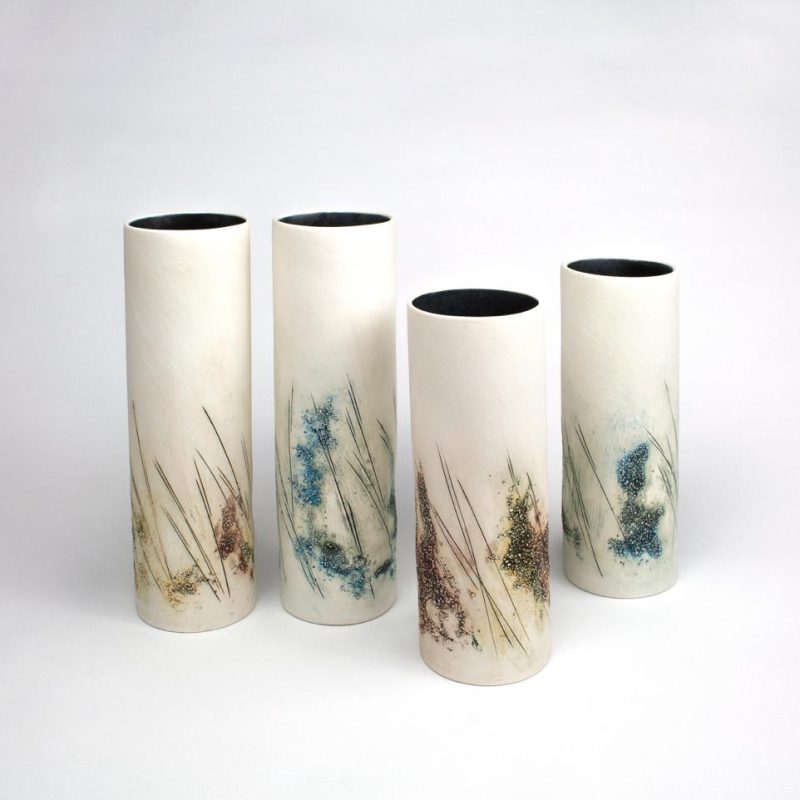 Small ceramic pots with flower decoration. Ideal for wild flowers