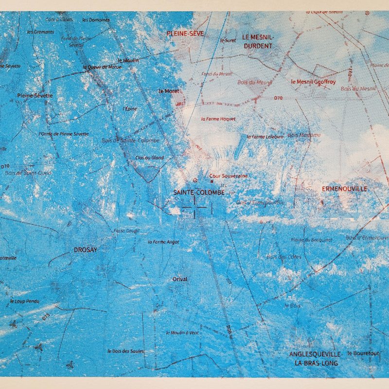 half-tone photographic screenprint of landscape containing a water tower super imposed with a map
