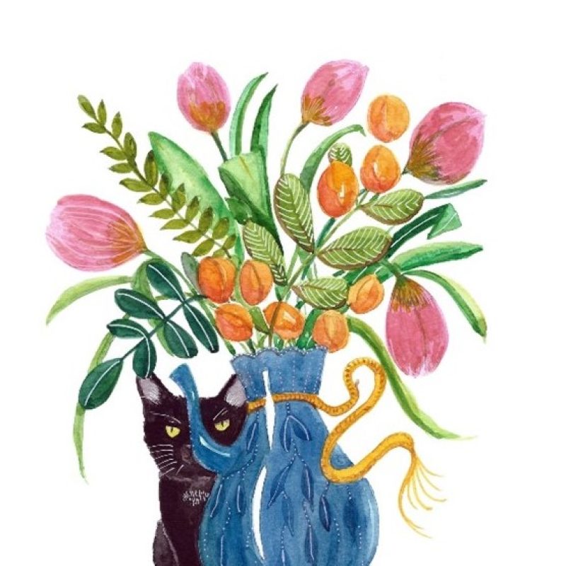 A black cat is peeping around the side of a vase of flowers