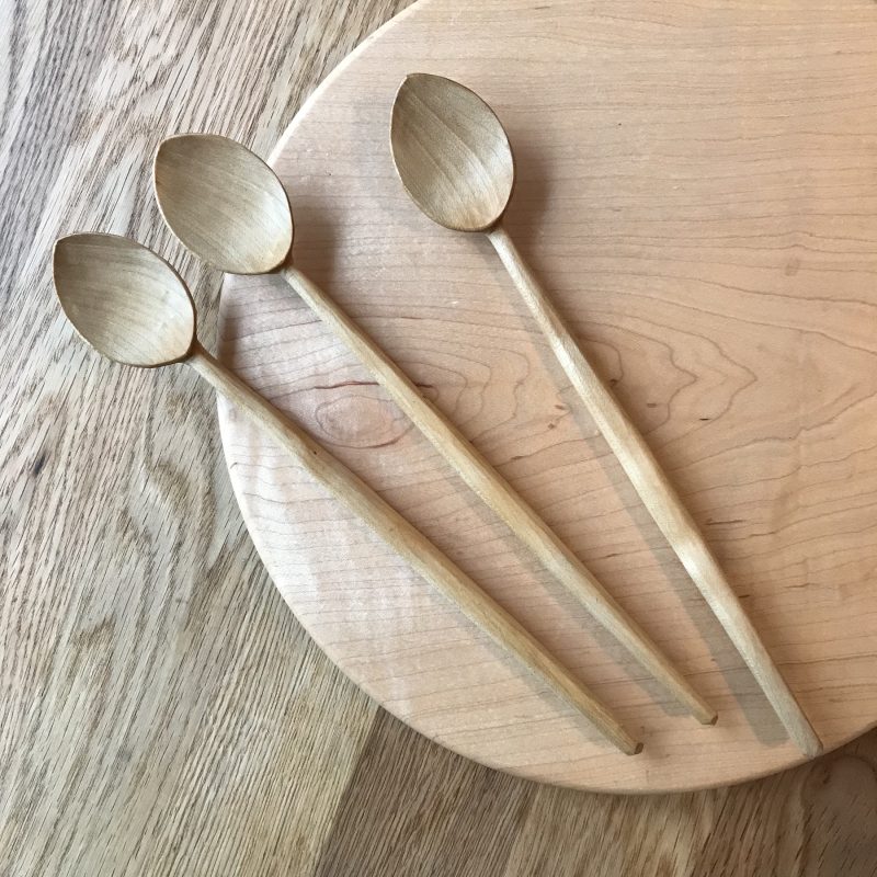 three hand carved baked sycamore tasting spoons