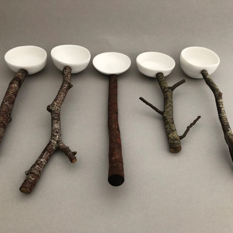 five ceramic spoons with tree branch handles