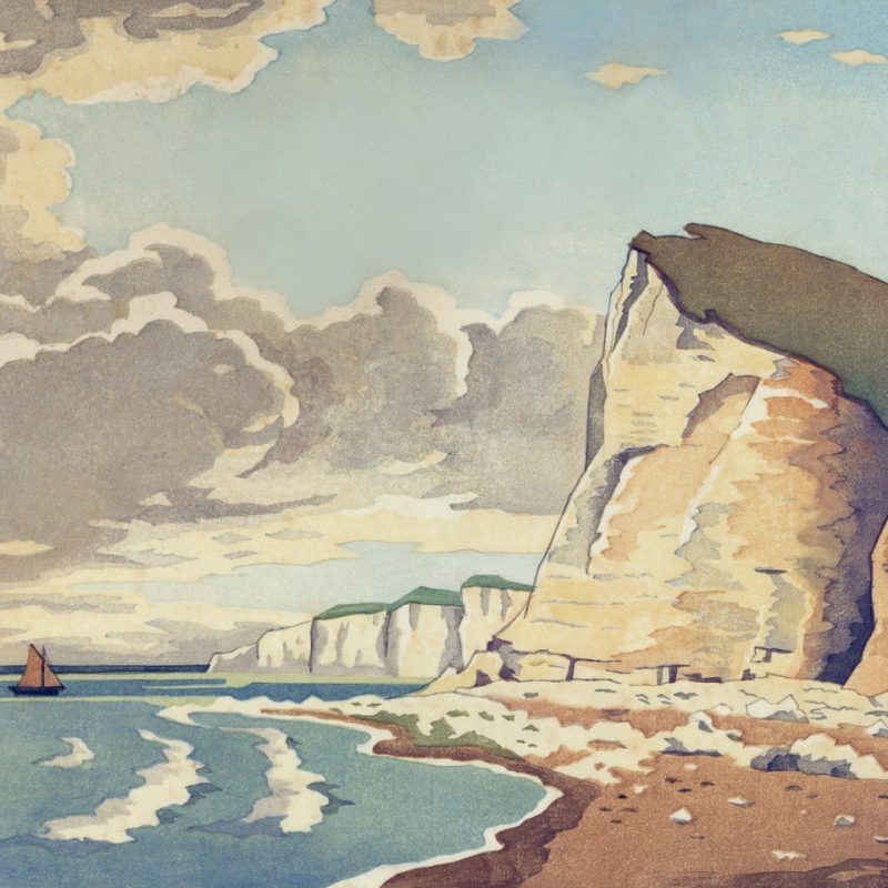 Image features cliffs in Seaford with a cloudy sky and a little boat in the sea.