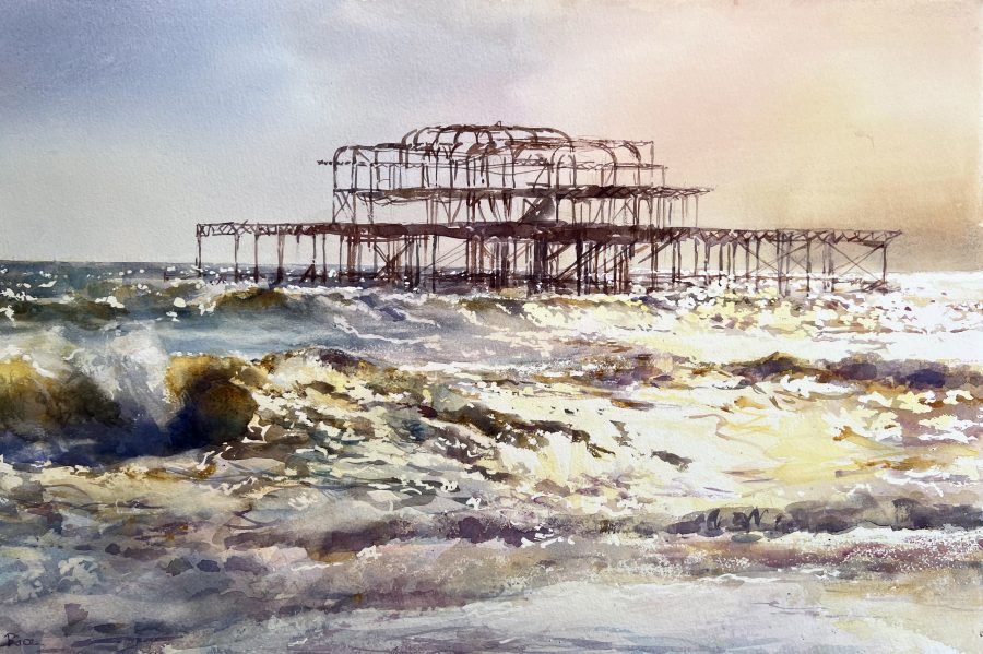 West pier with sunlit waves and beach