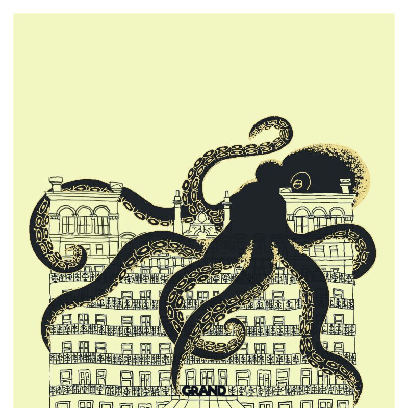 A print of an illustration of the Grand Hotel and a black octopus on top.