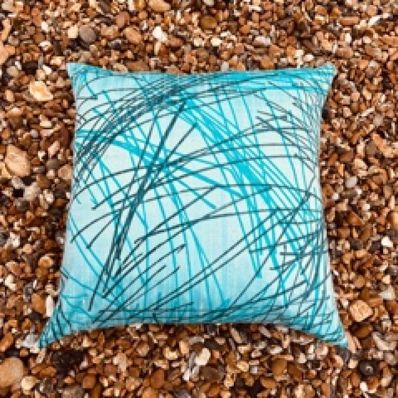 Silk turquoise square cushion with two tone blue linear crosshatched design.