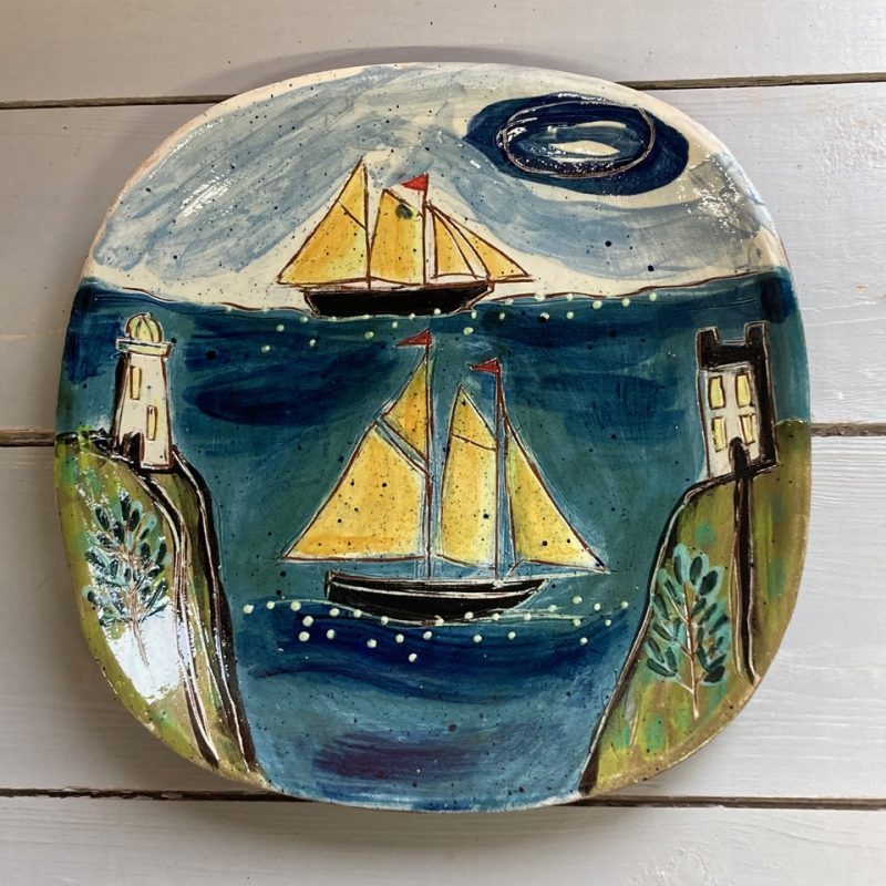 plate decorated with  boats 
